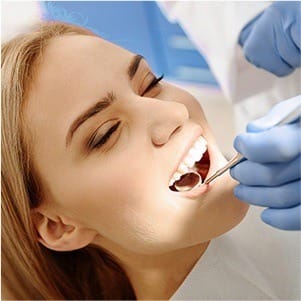 Woman receicing dental treatment