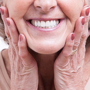 woman smiling after getting dental implants in North Naples