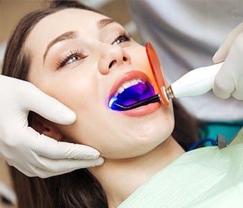 Patient receiving cosmetic dental bonding