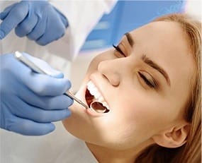Woman receiving dental exam