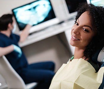 Smiling woman in dental chair