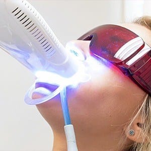 Patient receiving in-office teeth whitening