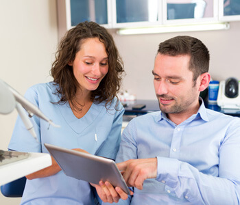 patient talking to a dentist