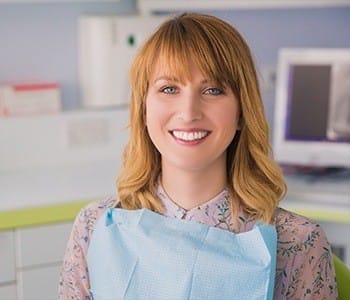 Smiling woman in dental chair