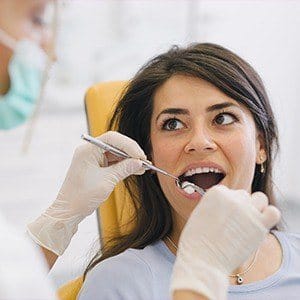 Woman receiving dental treatment