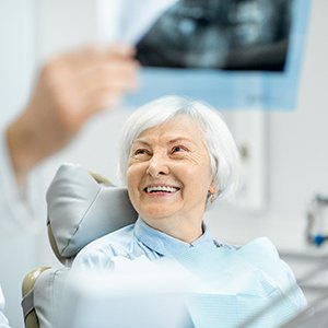 patient smiling during dental implant consultation in North Naples