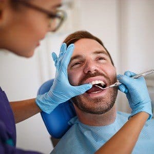 Man receiving dental exam