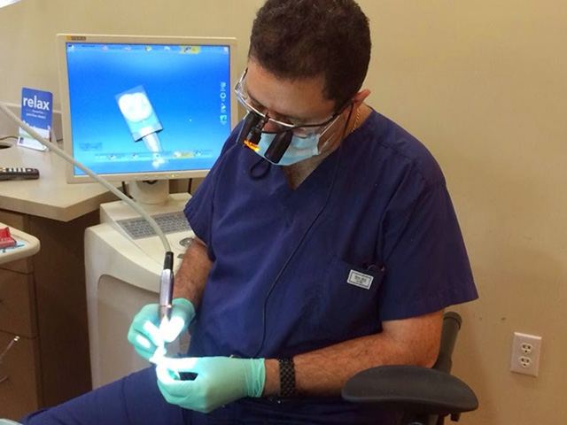 Dentist working on dental restoration