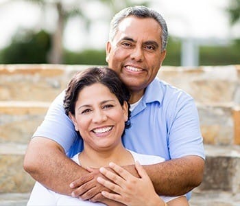 Smiling older man and woman outdoors