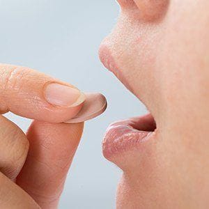 Patient taking oral sedative pill