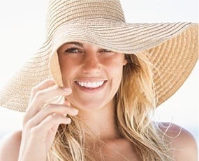 Woman with sun hat outdoors
