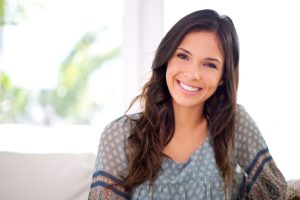 woman with a beautiful smile thanks to the dentist naples residents trust