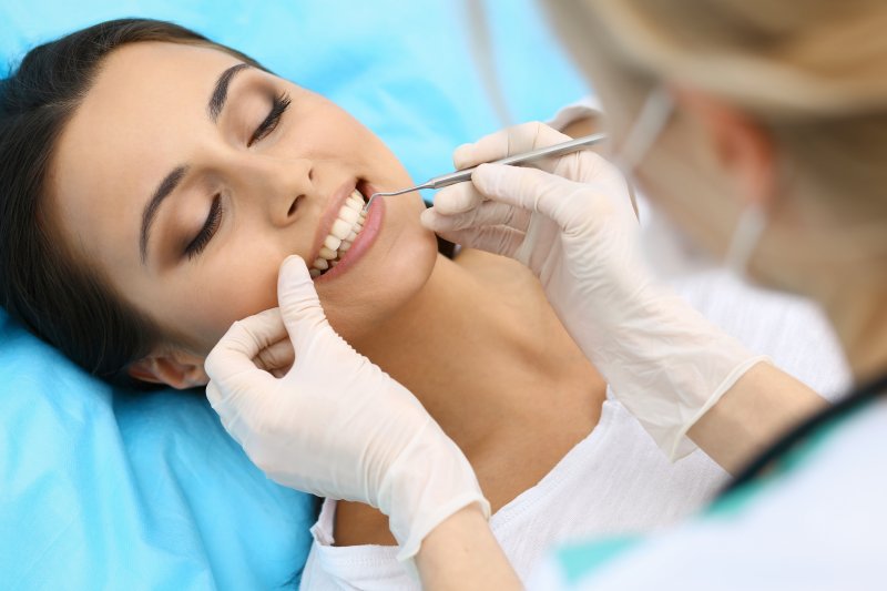 a woman having her teeth checked