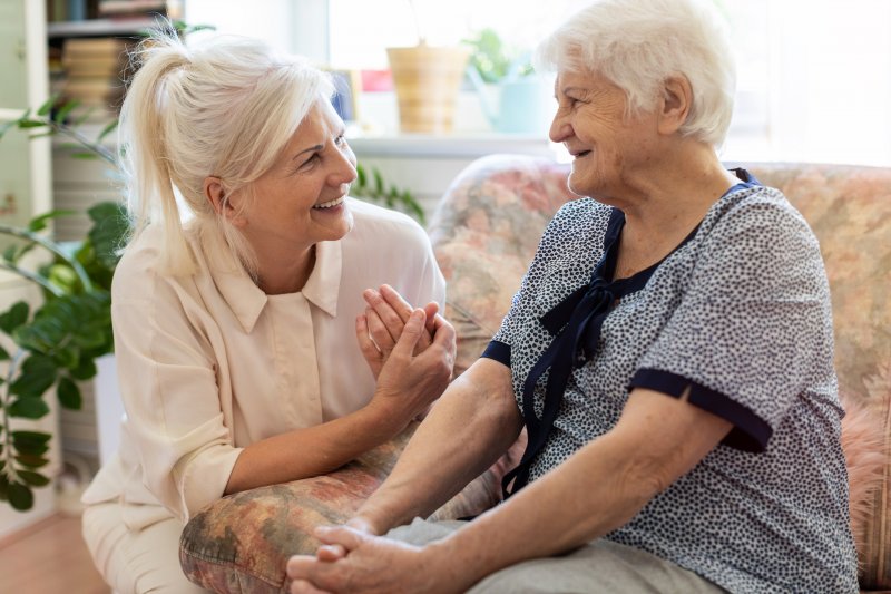 a woman talking to another lady with Alzheimer’s disease